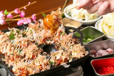 1 Day Takoyaki Making and Osaka Castle Walking Tour - The Osaka street tram stop: a tiny ride with big personality