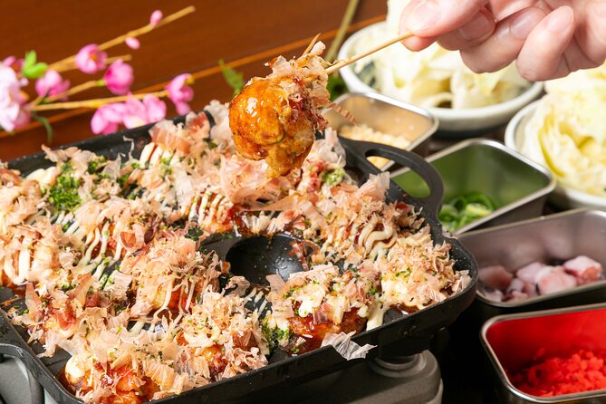 1 Day Takoyaki Making and Osaka Castle Walking Tour - The Osaka street tram stop: a tiny ride with big personality