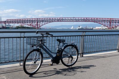 Half day Osaka Bay Area Cycling with E-Assist Bicycle Tour - Shinkizugawa Bridge: views toward Tennoji and a photo-friendly descent