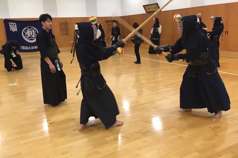 Osaka: Kendo Workshop Experience - Getting geared up: rental armor, bamboo swords, and the men face protector