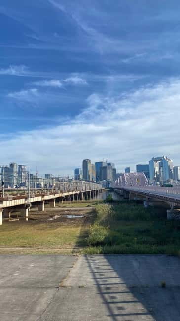 Urban Canvas: Osaka Street Art Bike Tour - Stop 1 in Osaka: Train Lines, Rivers, Bridges, and the Underground Stories